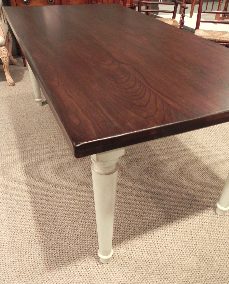 Walnut finish table with white glazed turned legs