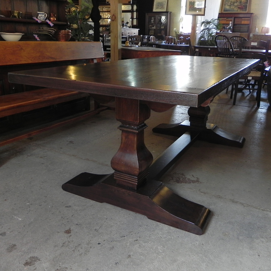 Medium oak finish trestle base baluster table