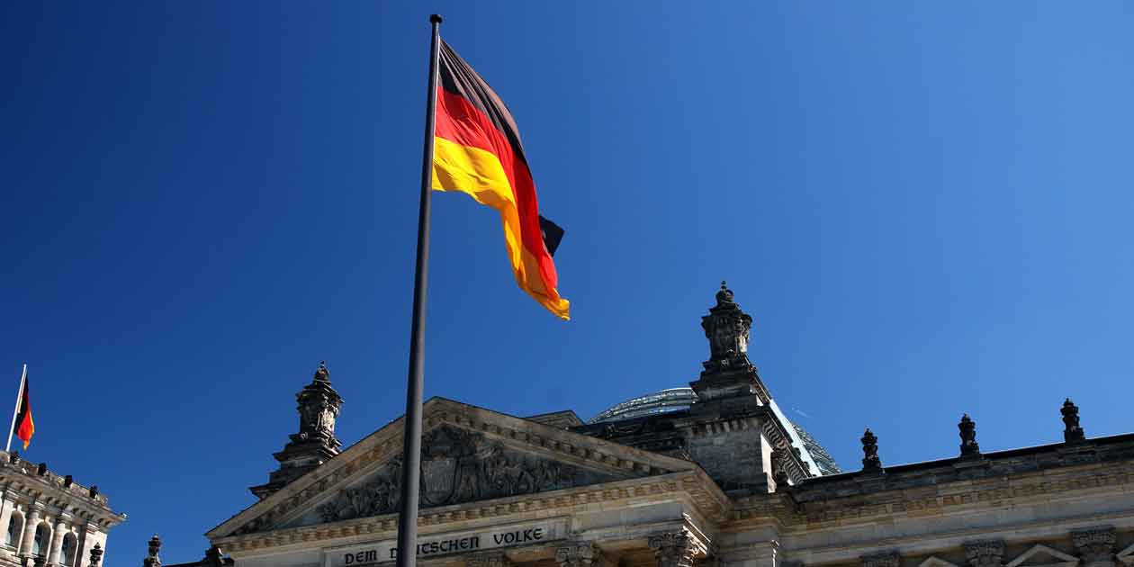 The German flag flies in front of the Bundestag, the national parliament of Germany. Photo by Thomas Ormston, licensed under CC BY-NC-ND 2.0.