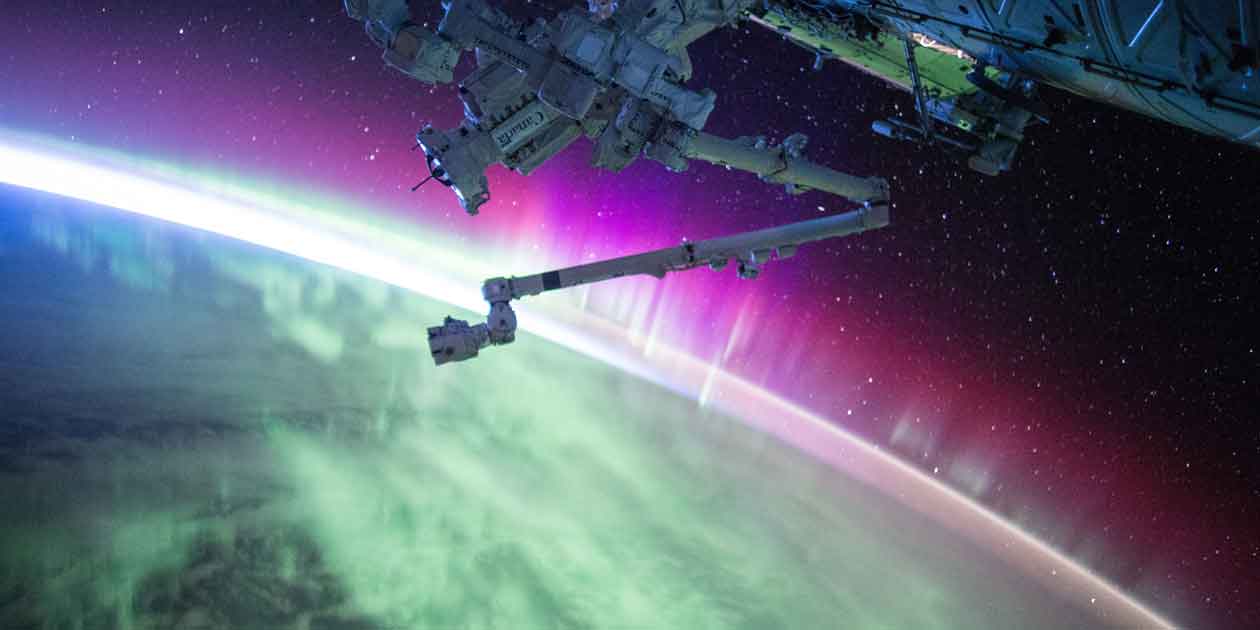 Photo of the International Space Station and the aurora by NASA.