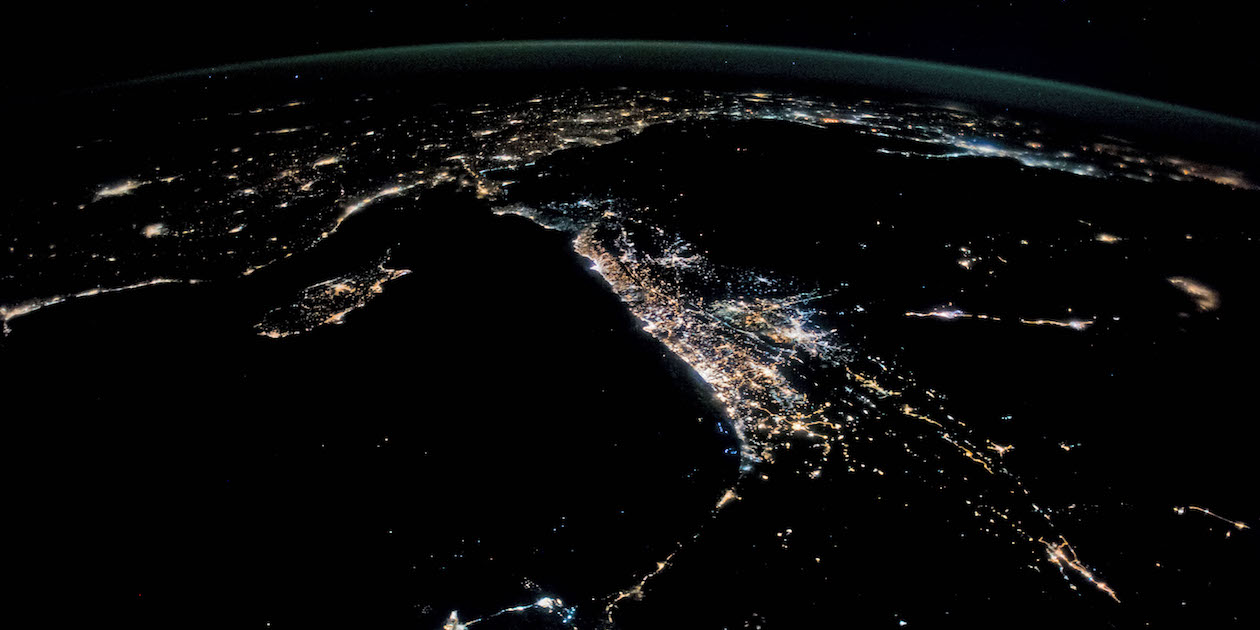 Where the coastline begins to curve gently in the lower center of the picture lies the West Bank. Photo by the ISS Crew Earth Observations Facility and the Earth Science and Remote Sensing Unit, Johnson Space Center, via NASA, in the public domain.