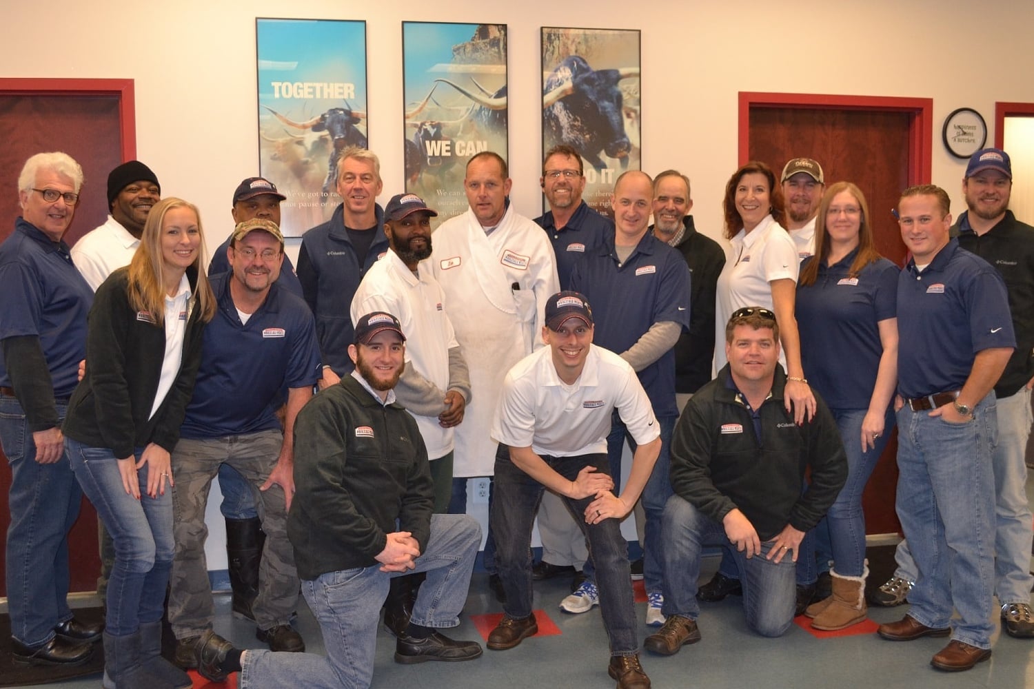 Group photo of staff from Fells Point Wholesale Meats in their office
