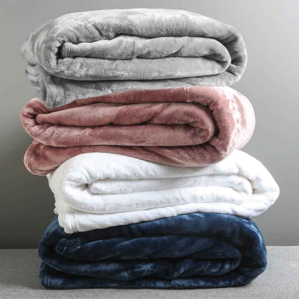 A pile of Luxe microfibre blankets