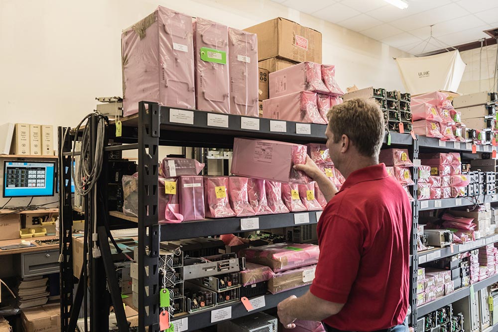 Todd Pulling a Power Supply from Inventory