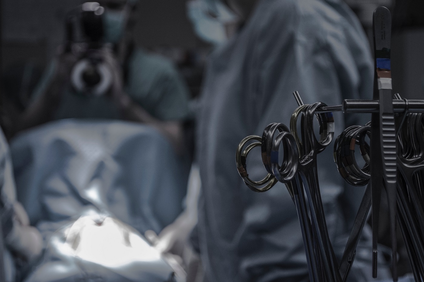 Operating room with medical instruments and doctors working