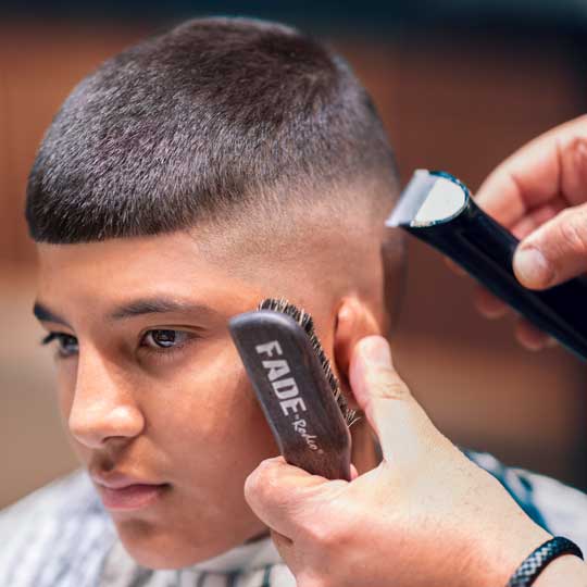 Barber doing skin fade hairstyle