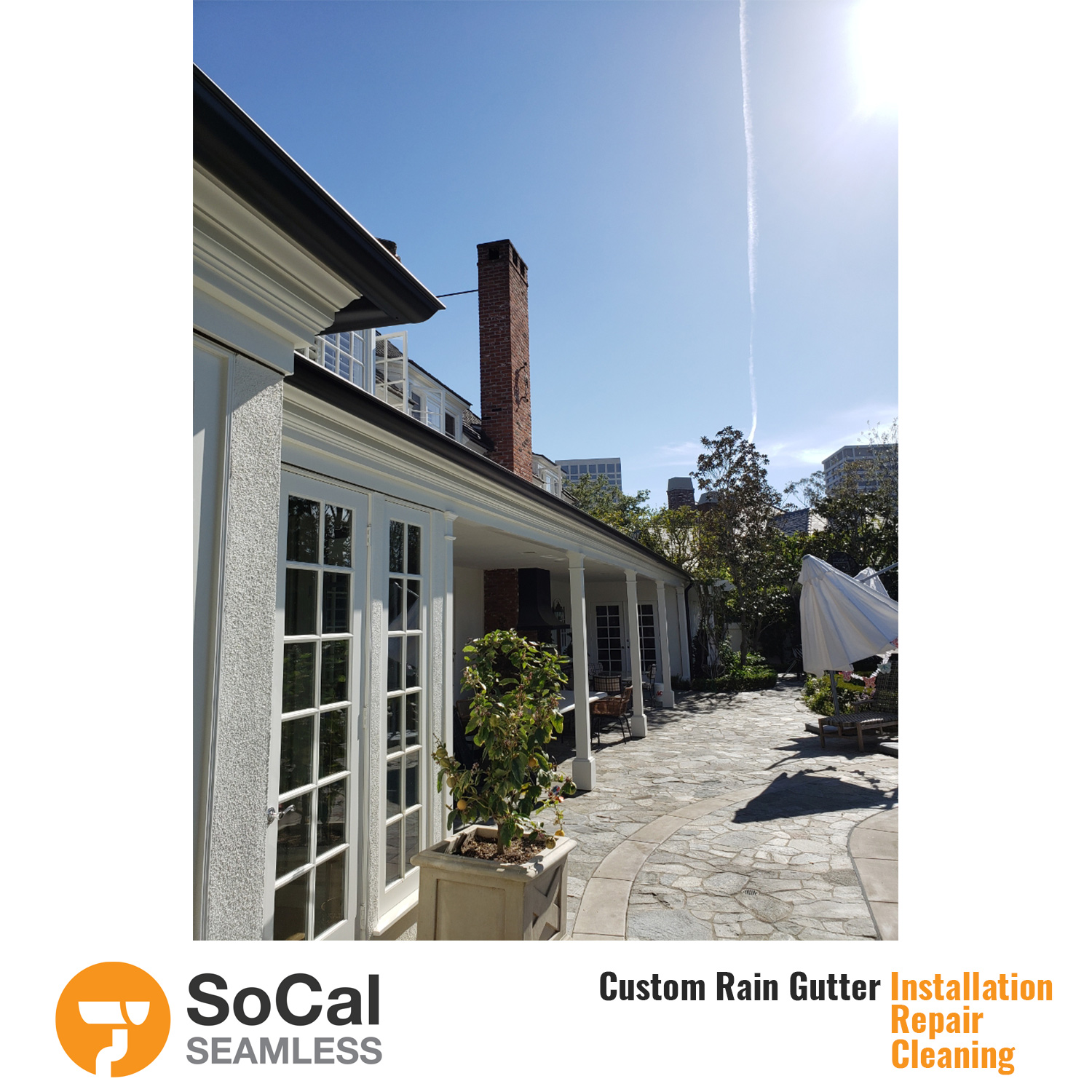 large patio and home with half round black rain gutter installation socal seamless