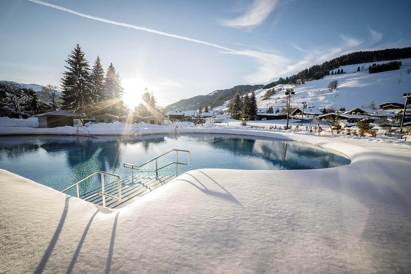 A pool in a snowy placeDescription automatically generated with low confidence