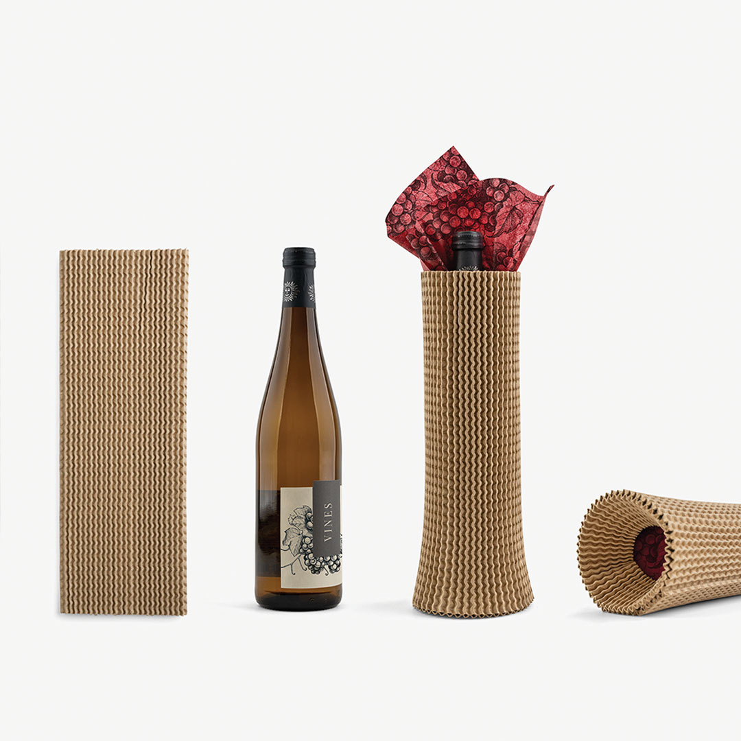 Slivv next to a wine bottle packaged with tissue paper