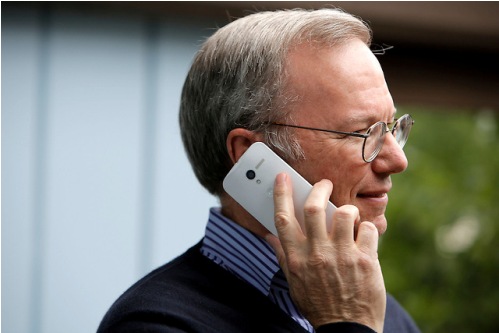 Eric Schmidt, executive chairman of Google, uses the yet to be released Google produced Moto X phone during day two of Allen and Company's 31st Annual Media and Technology Conference in Sun Valley, Idaho, July 10, 2013. The event brings together the leaders of the worlds of media, technology, sports, industry and politics. INSIDER IMAGES/Gary He (UNITED STATES)