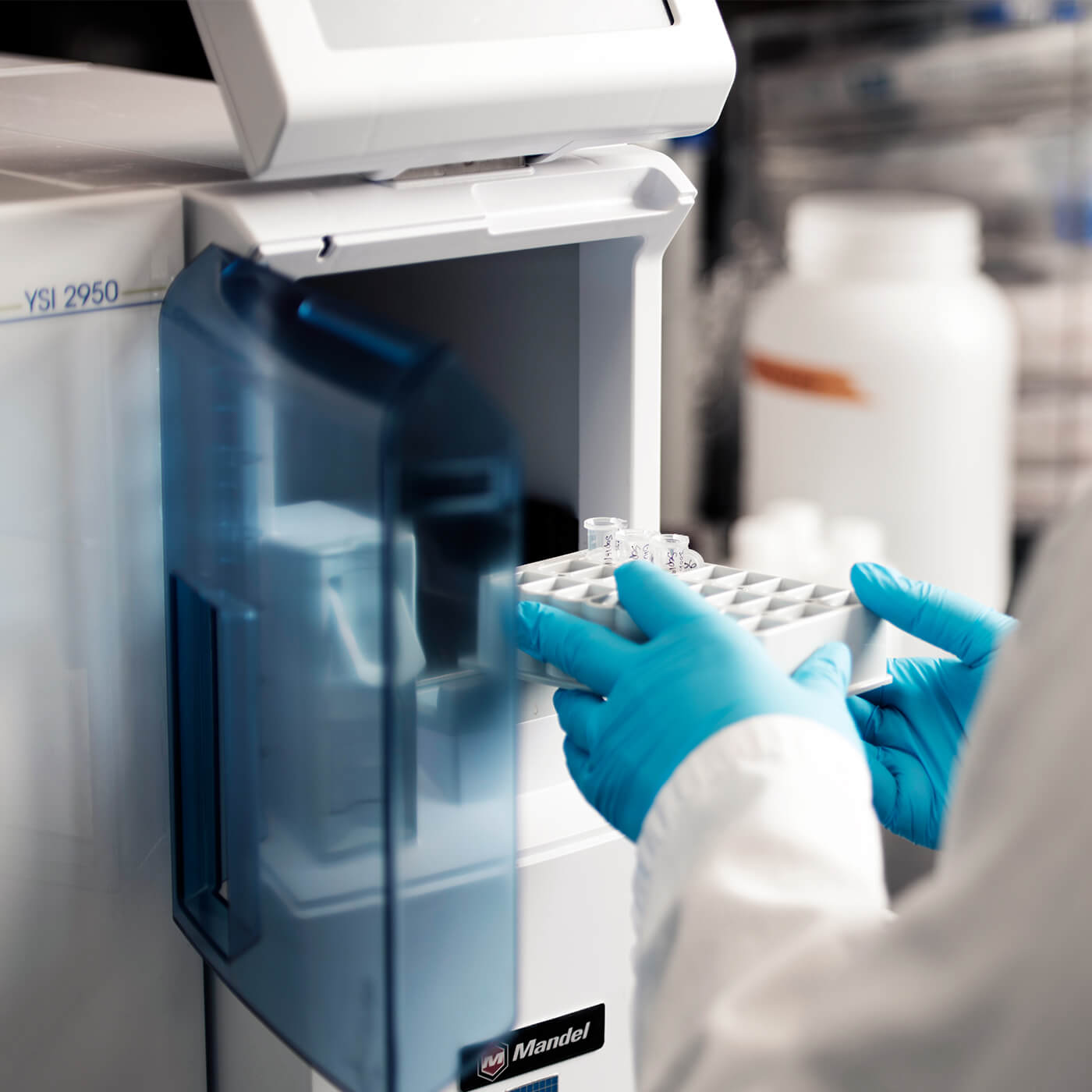 A scientist using a biochemistry analyzer