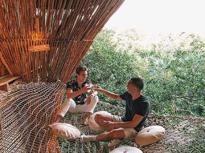 Travelers socializing and meeting new people while traveling