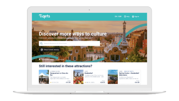 Buying tickets on a laptop with Tiqets.