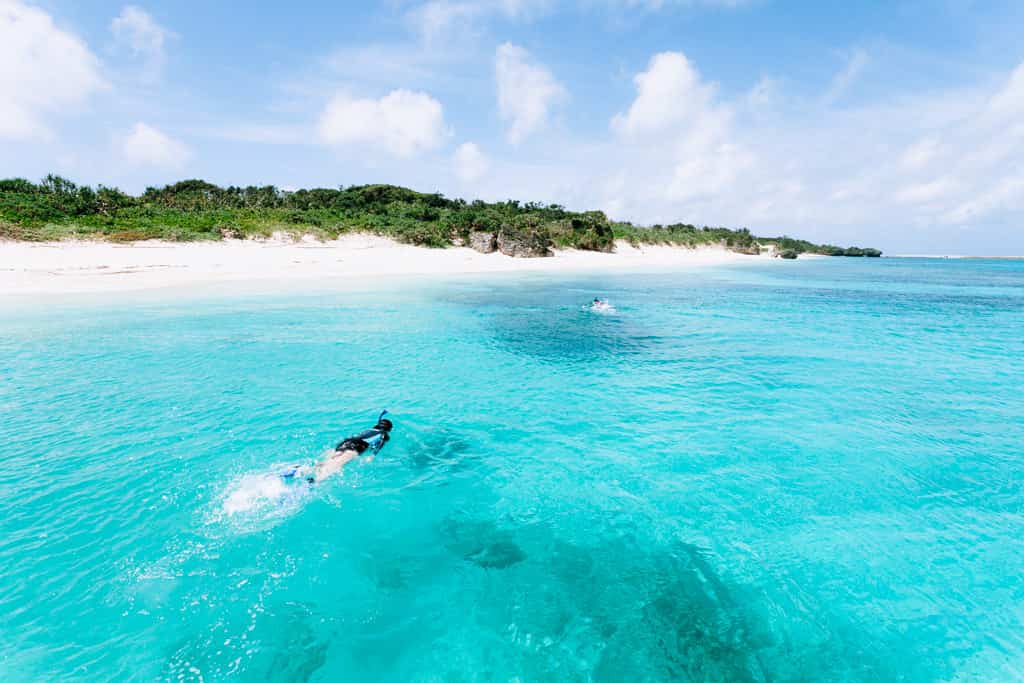 person snorkeling at Aragusuku beach