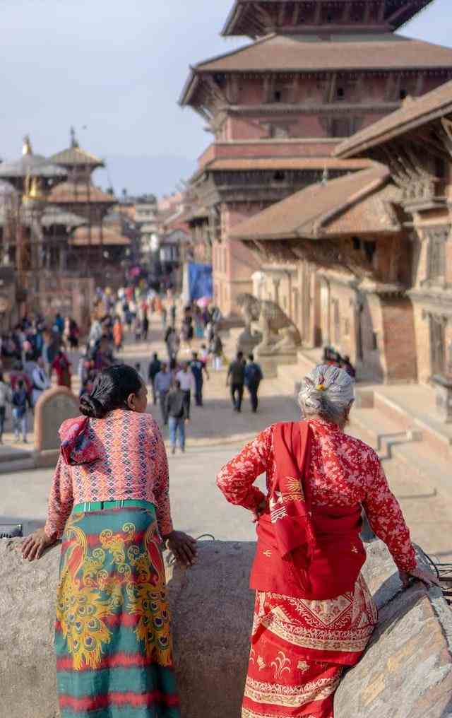 women overlooking the streets of Kathmandu