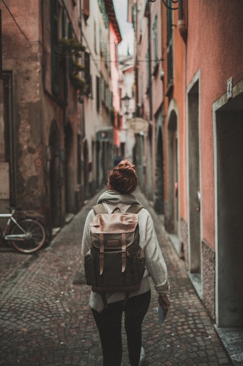 female traveler exploring alley abroad