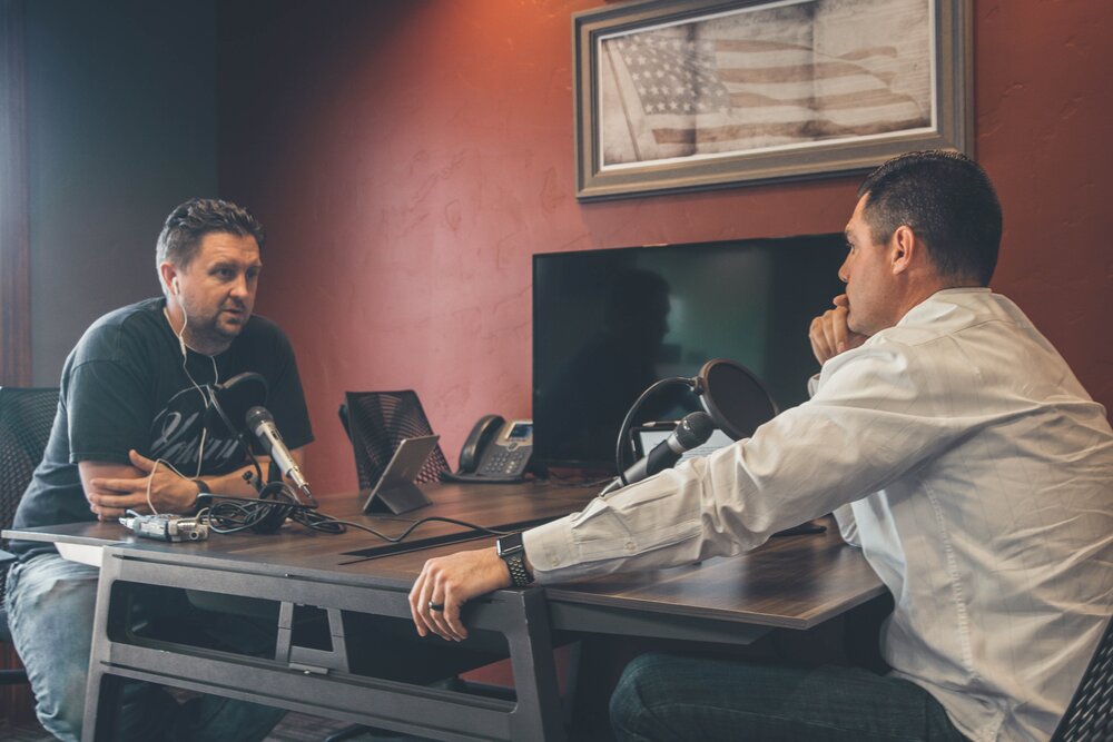 A podcast host and interviewee discussing human resources