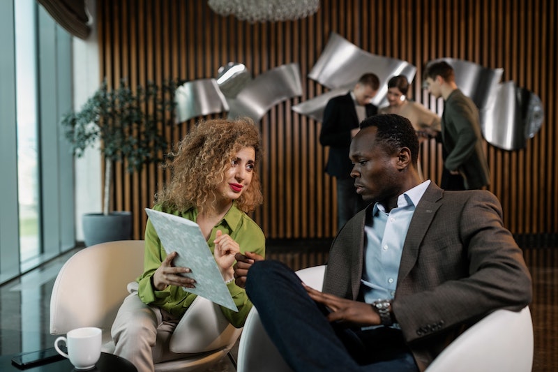 A male and female colleague collaborating
