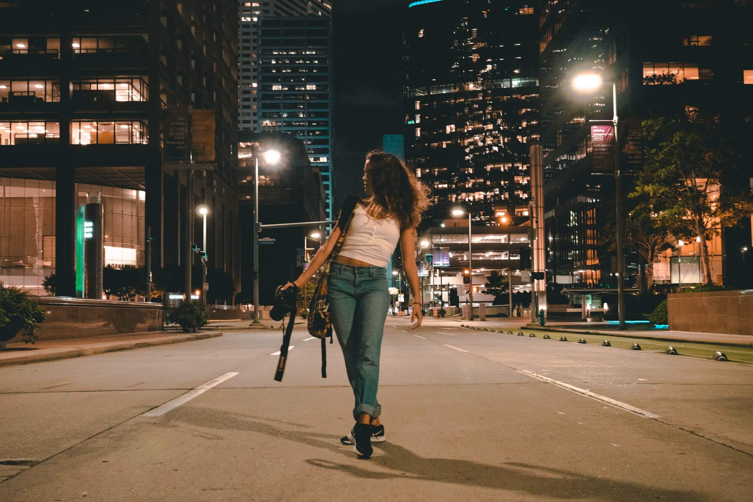 Girls walks down the empty streets of Houston, illustrating the population loss outlined in Unacast's white paper, "Houston's billion dollar break up"