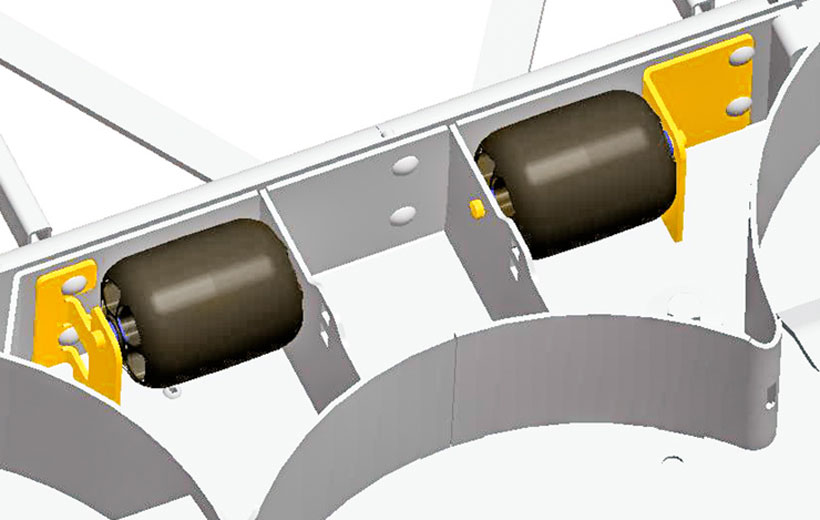 Image of two black wheels mounted on the underside of a mower deck.