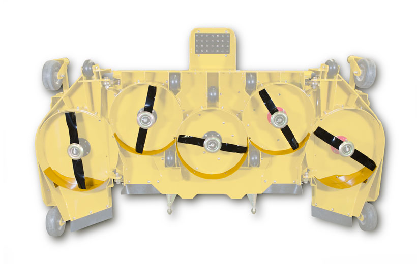Image of the underside of the 104in mower deck showing the metal pieces in yellow around the blades.