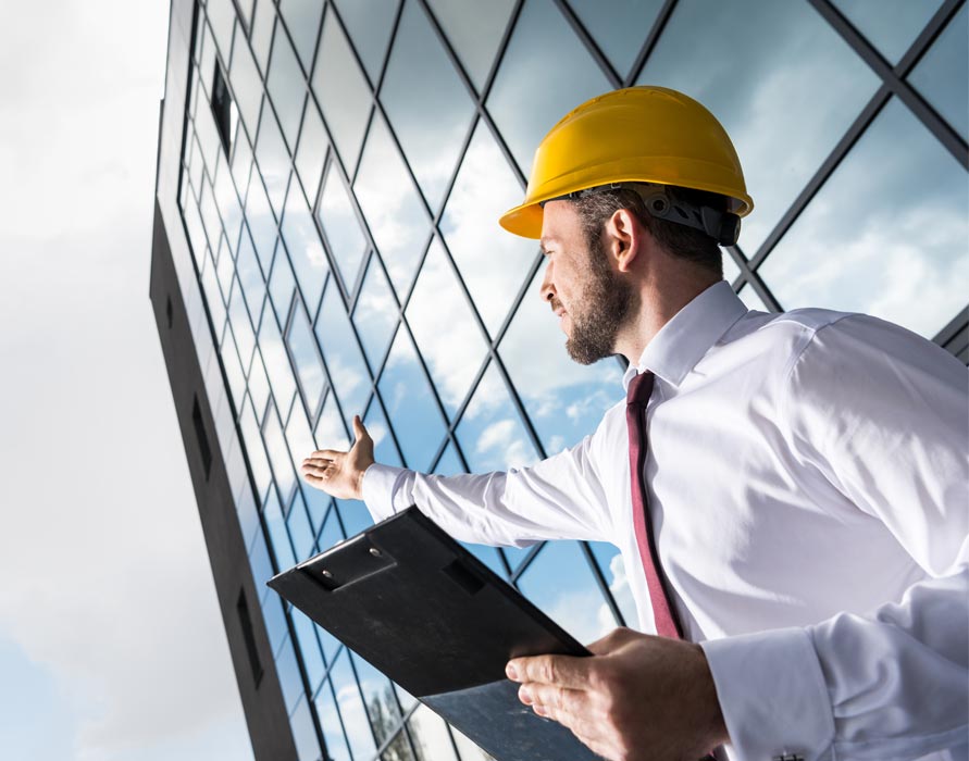 contractor looking at building