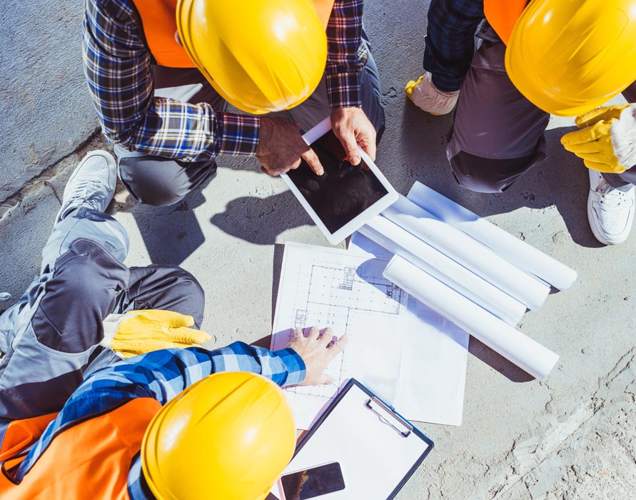 contractors reviewing blueprints