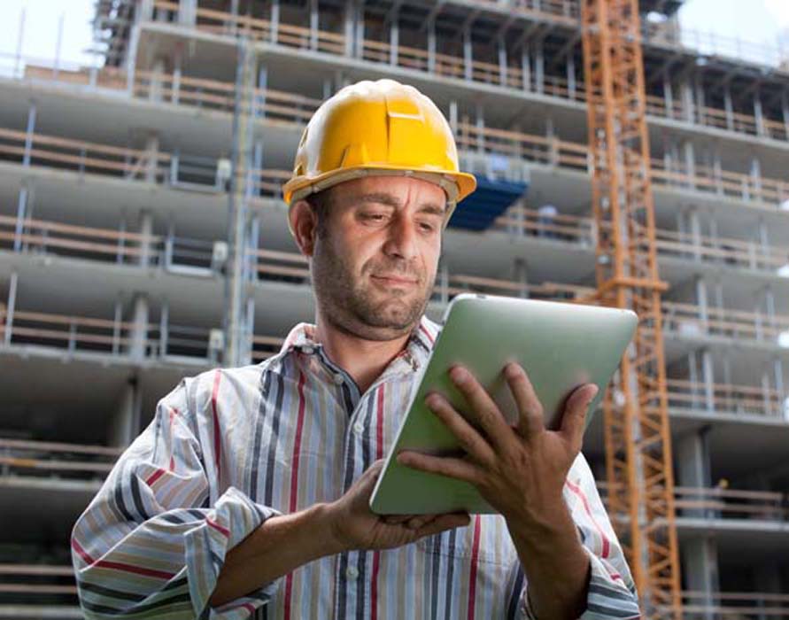 general contractor reviewing bid plans