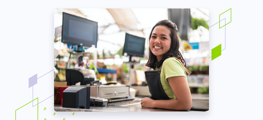 Woman working at register in supermarket