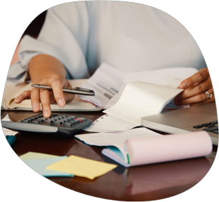 A woman using a calculator to compare freight costs
