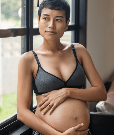Pregnant woman looking outsite
