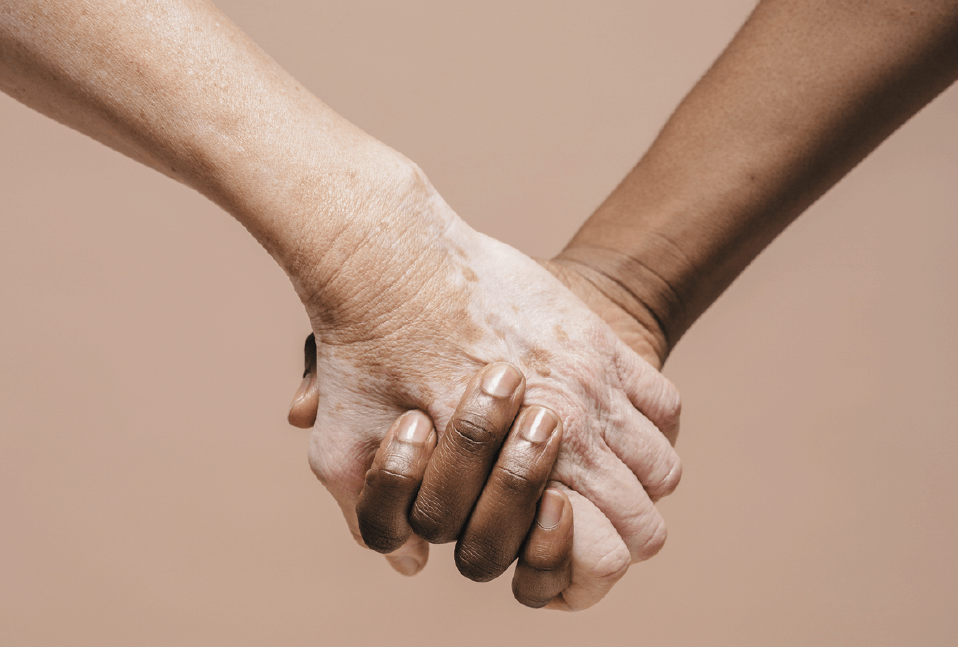 Two women holding hands