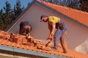 roofers installing tile roof