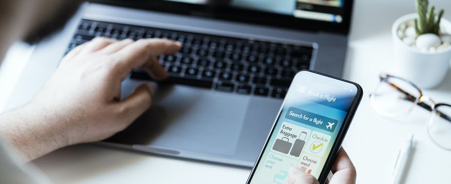 Booking a flight on mobile and desktop