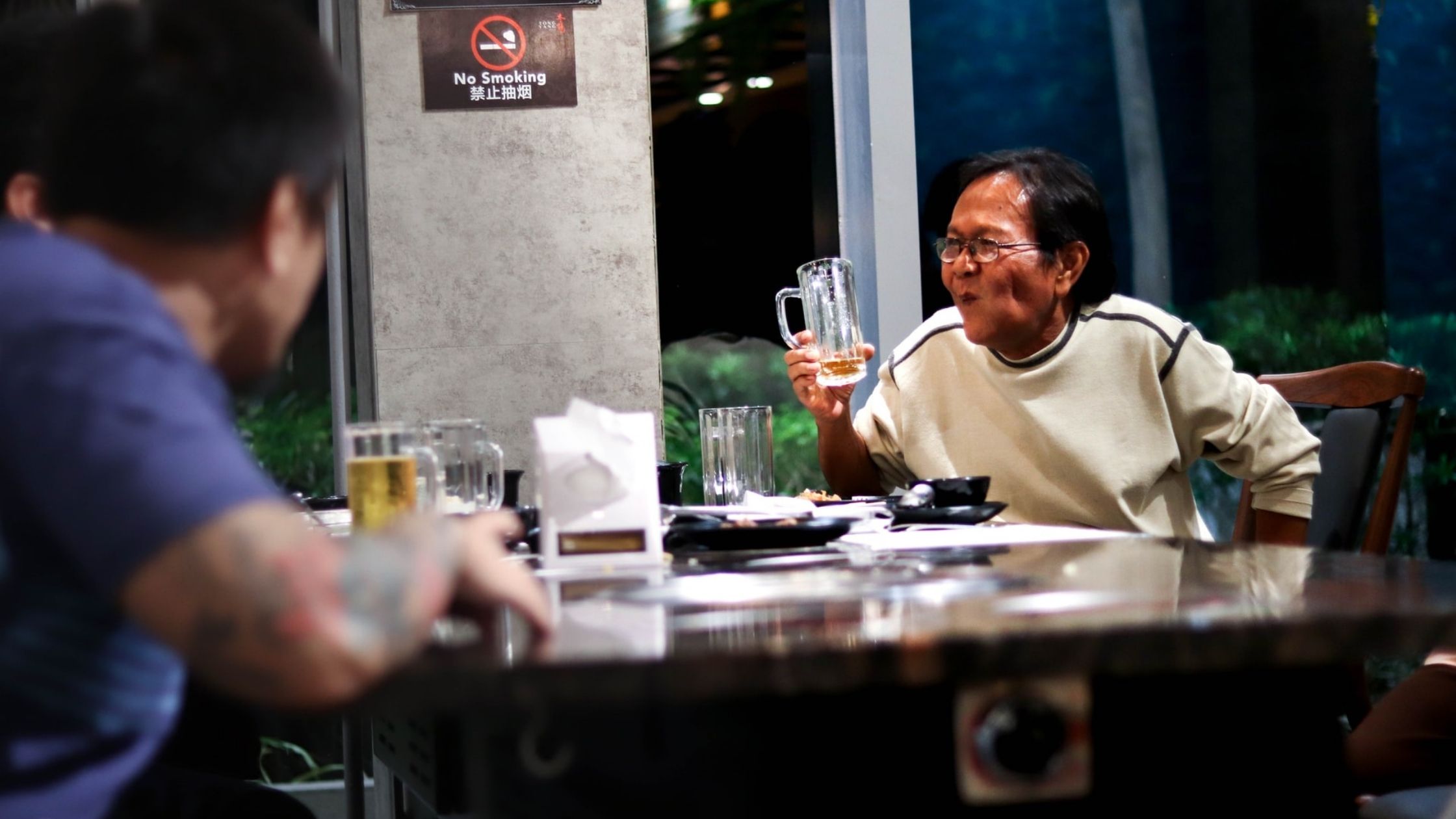 A Dad Holds Up A Beer