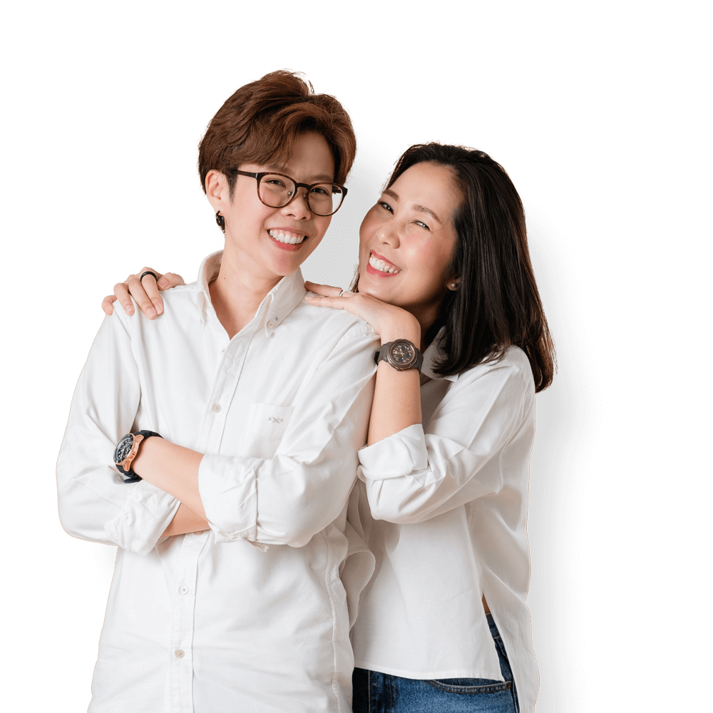 A smiling asian lesbian couple