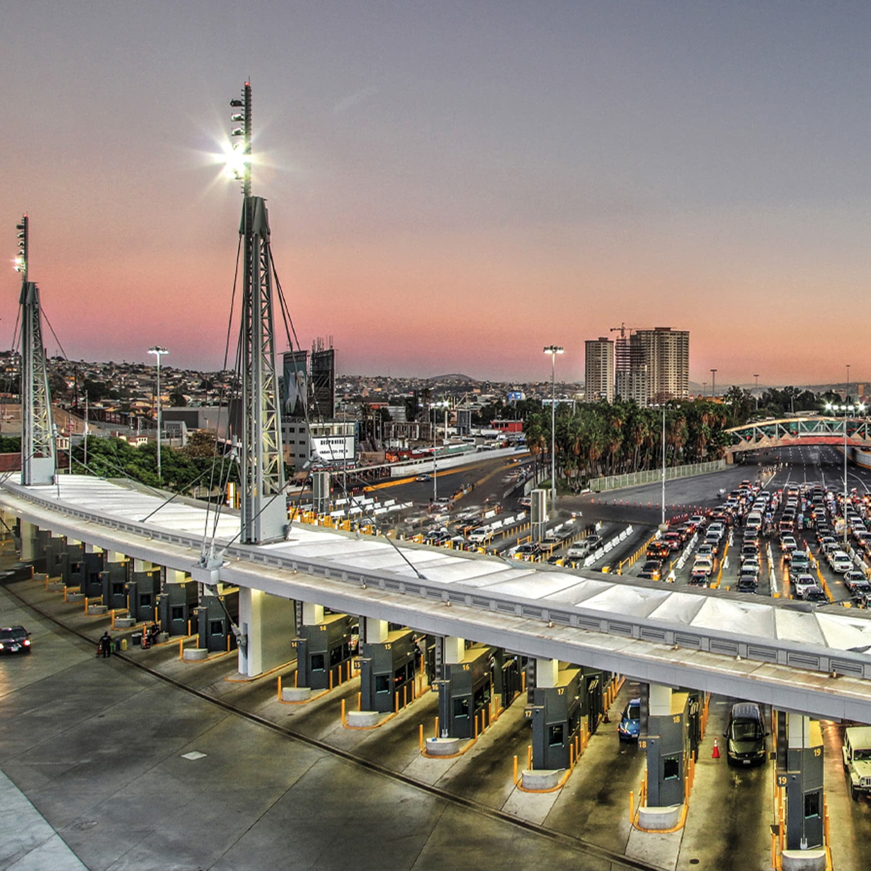 San Ysidro port of entry overhead view with cars lined up and sunset in the background