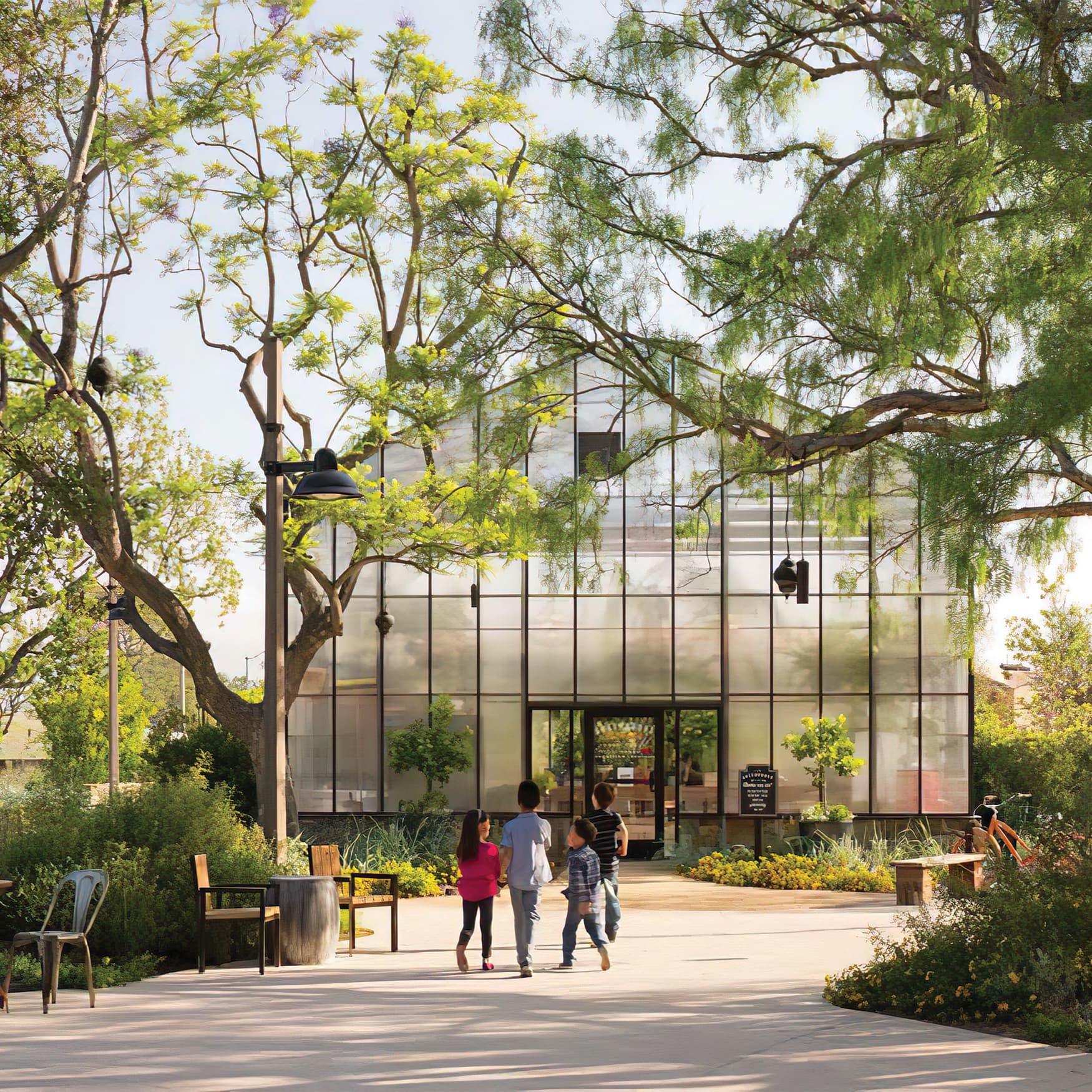 Children approach greenhouse surrounded by lush greenery