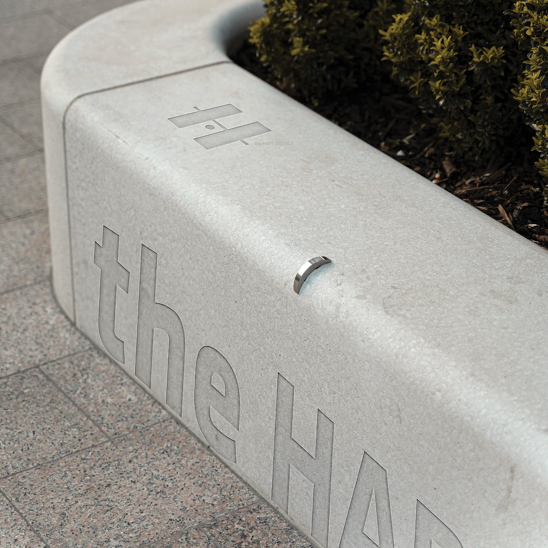 Engraved concrete bench logo of the HART District.