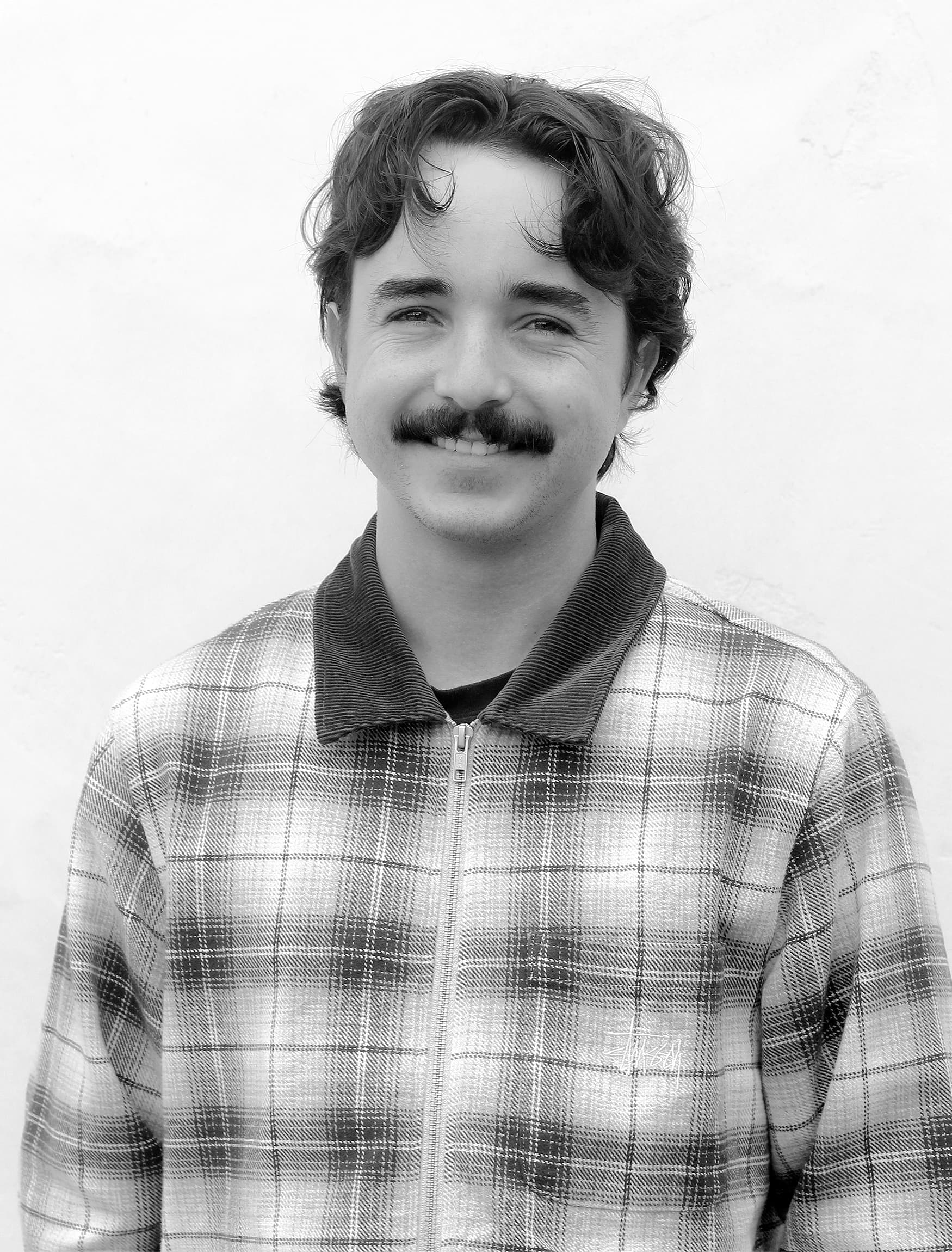 Black and white headshot image of Maxwell Helm designer at RSM Design