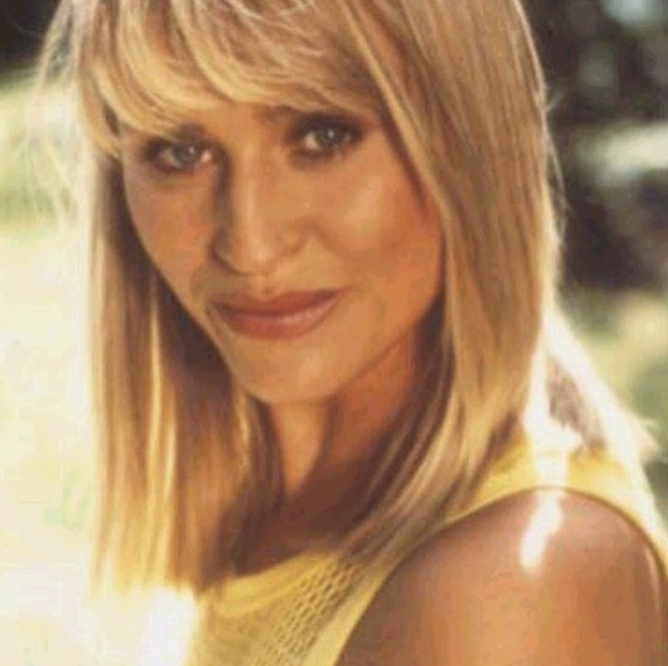 Photograph of clothed young blonde woman posing for Penthouse magazine