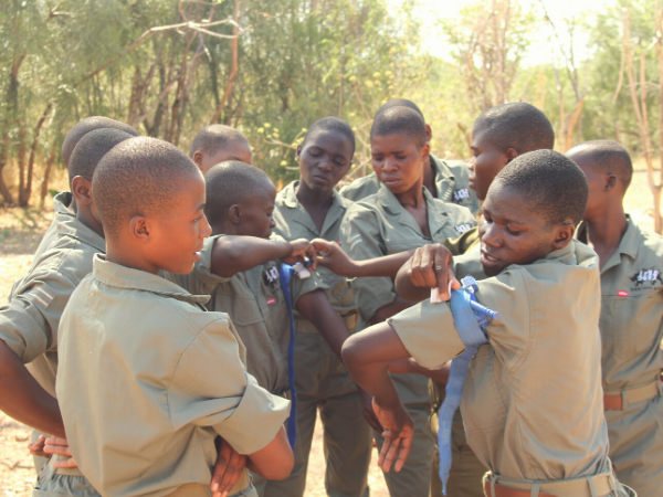 trainees practice tying the tourniquets