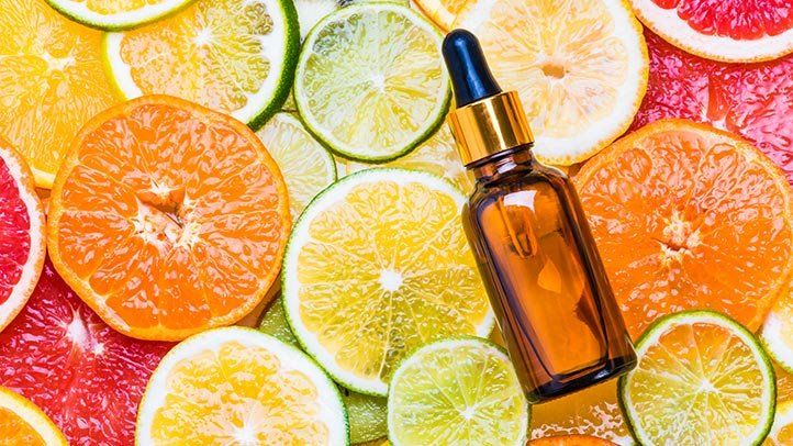 citrus fruits and dropper bottle.