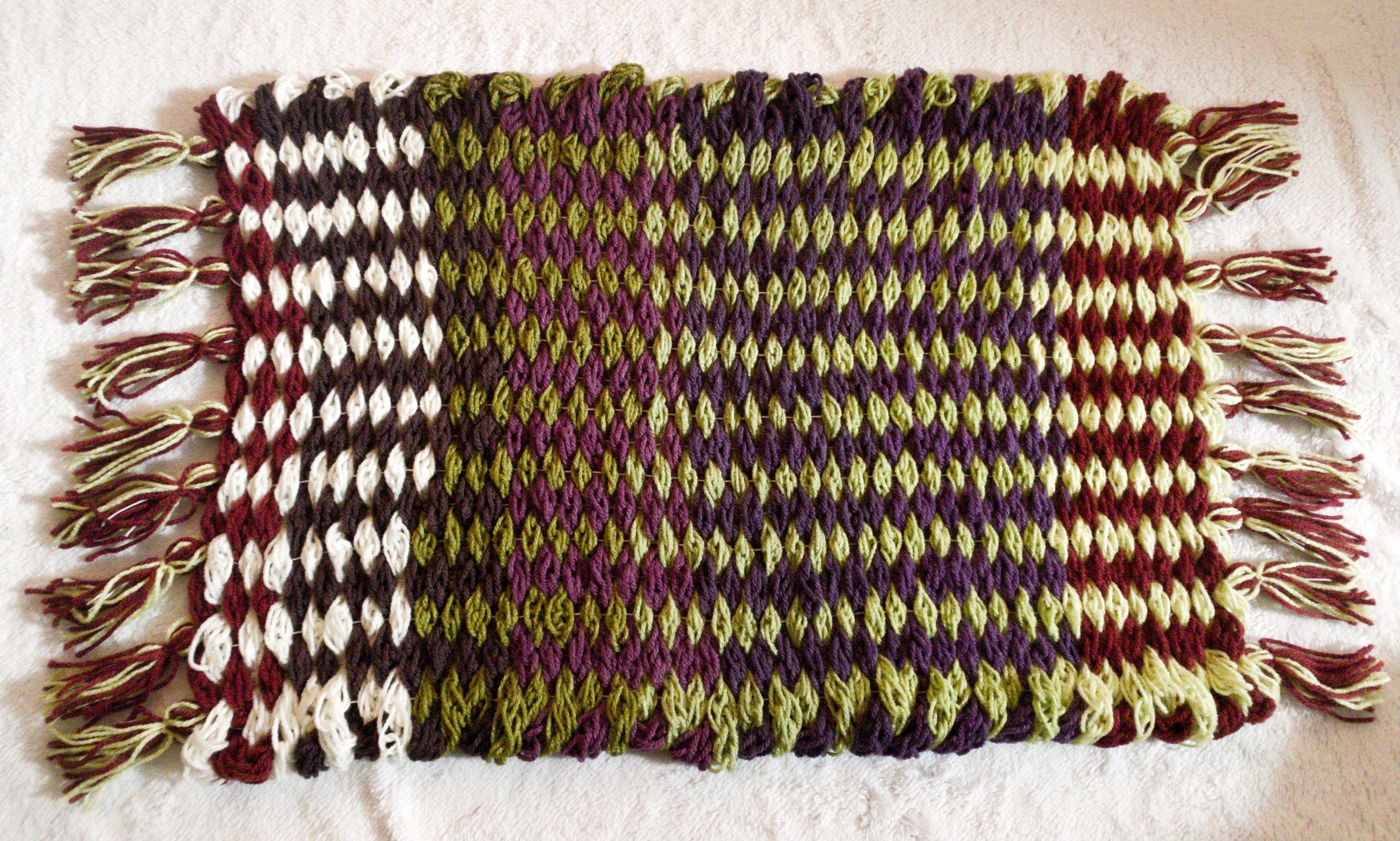 woven small door rug with tassels