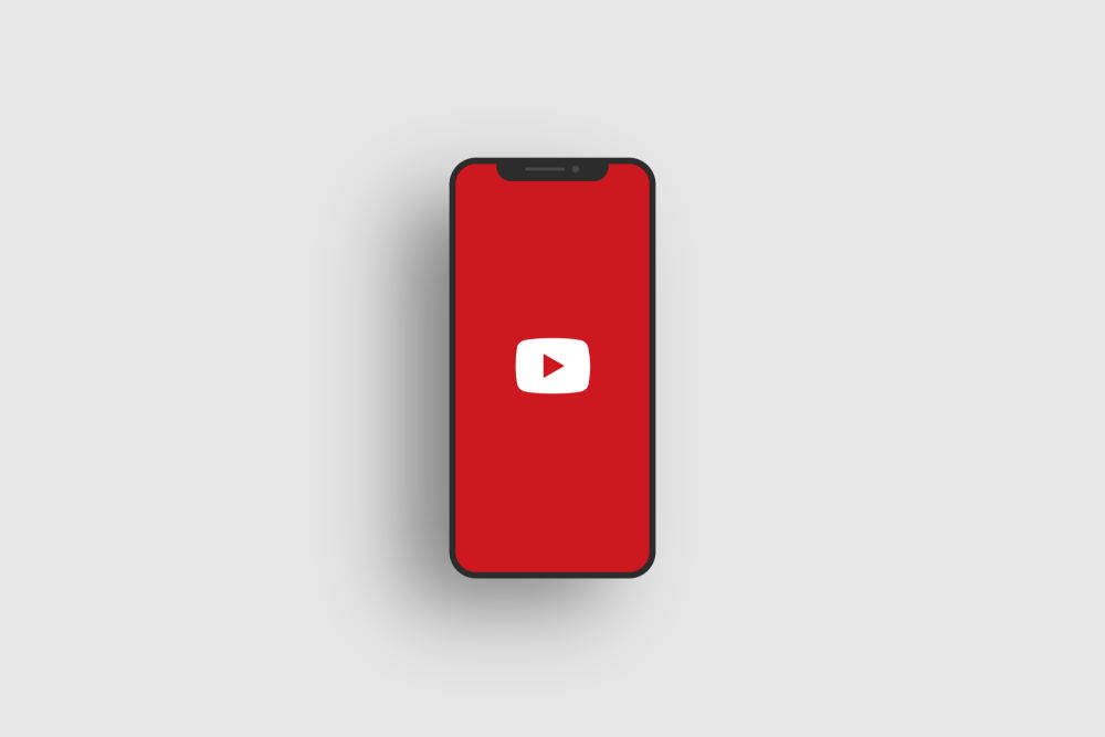 A mobile phone with the YouTube app displayed