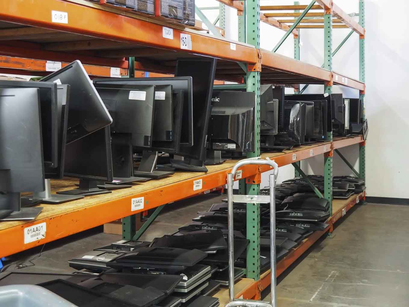 Donated monitors sit on shelves at the Tech Exchange warehouse. As part of the #OaklandUndivided initiative, refurbished devices are being given to students who don’t have a permanent computer at home.