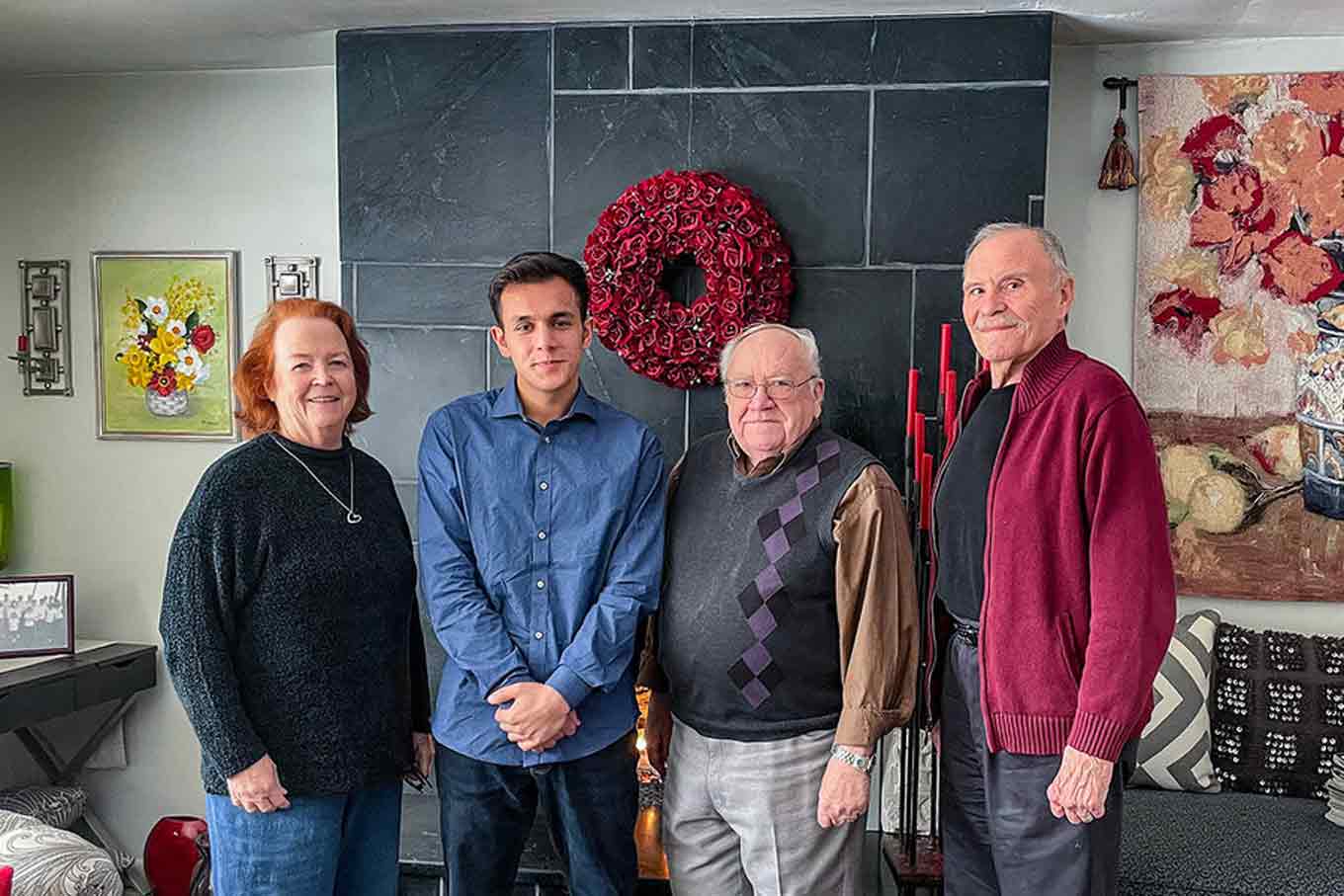 Mohammad poses for the camera alongside his three supporters for resettlement in the U.S