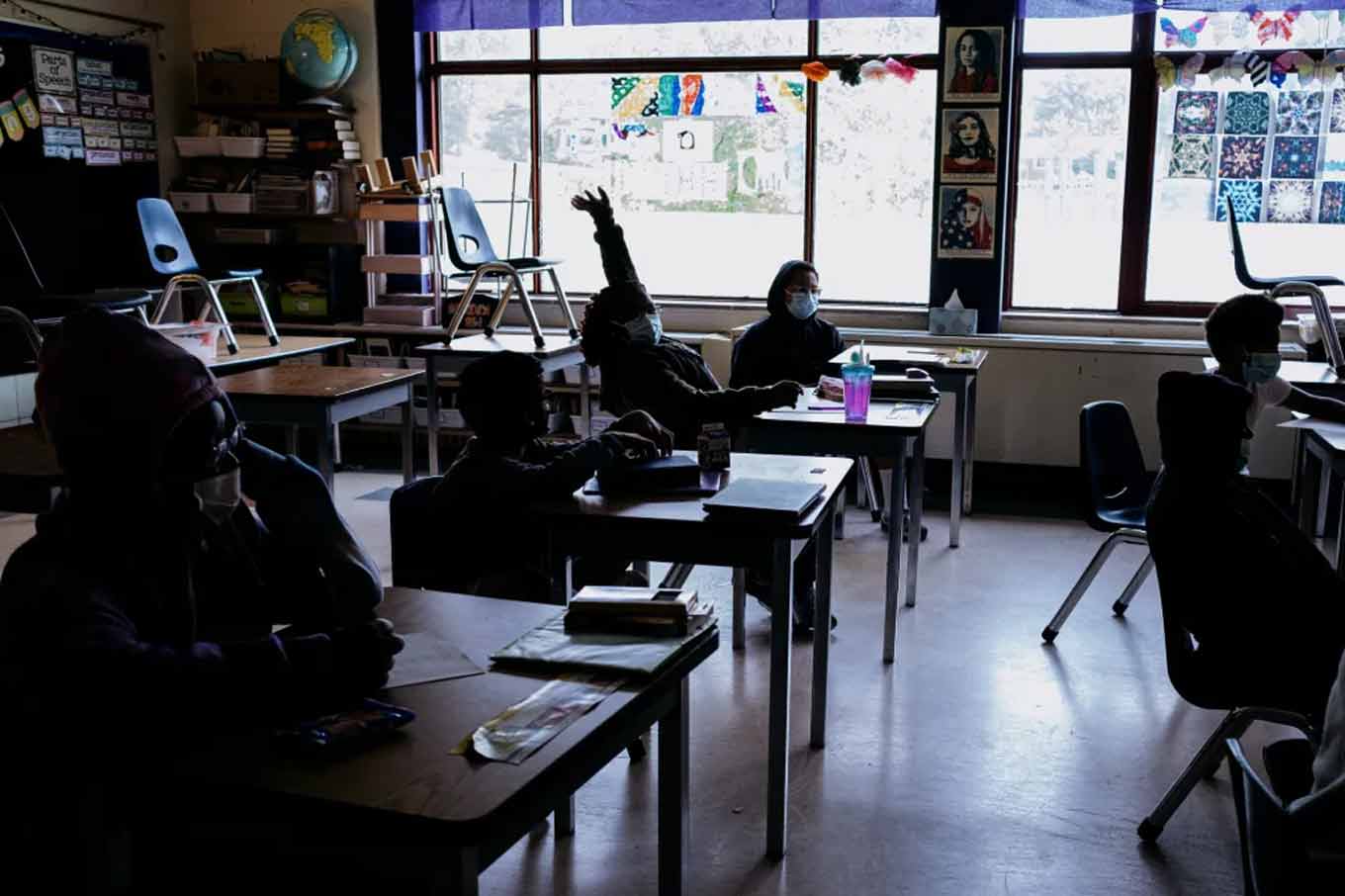 A classroom with students wearing face masks