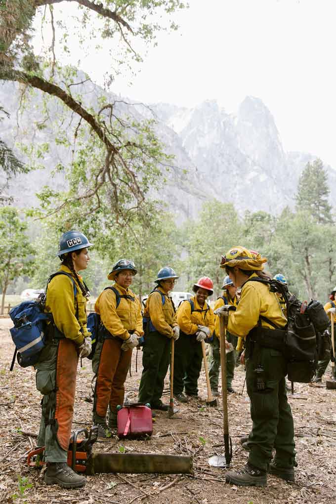 Members of the all-women wildland fire crew are briefed by their leader