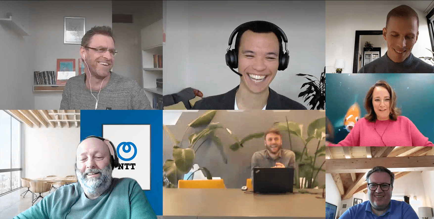 Participants of Mapiq Expert talks, smiling during the virtual session. Enhancing the office for hybrid work.